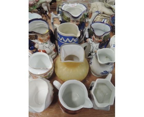 A selection of vintage ceramic jugs some in a Toby style