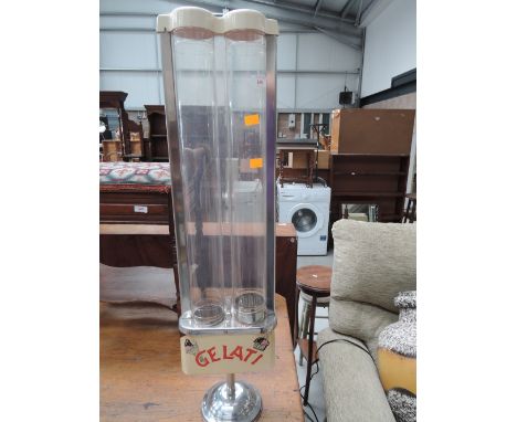 A vintage ice cream cornet dispenser, labelled Gelati