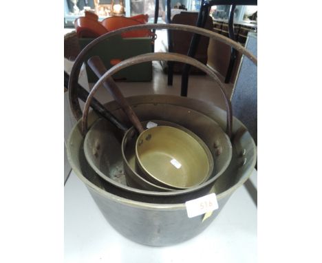 A selection of vintage brass cast sauce and jam pans