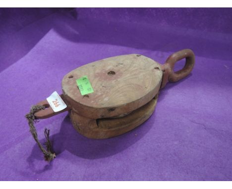 A vintage block and tackle wood and cast