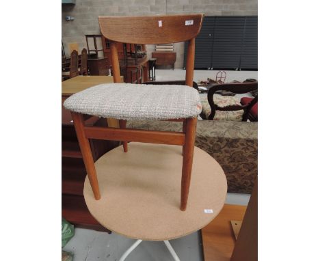 A vintage teak dining chair