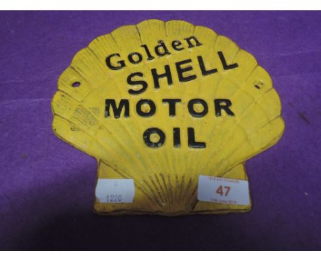 A vintage cast Motor oil advertising sign for garage fore court Golden Shell repainted
