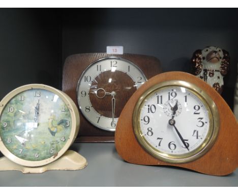 A selection of vintage mantle and bedside clocks including Smith alarm clock