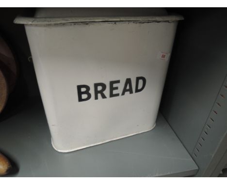 A large enamel and tin bread bin with impressed lettering