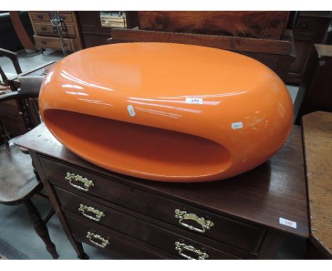 A vintage style egg coffee table, in orange