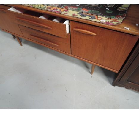 A vintage teak and laminate sideboard