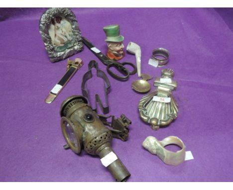 A selection of vintage trinkets and curios including cycle lamp, Beswick head etc