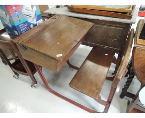 A vintage childs desk and seat