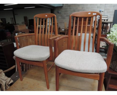 Two vintage teak carver chairs, labelled Benny Linden