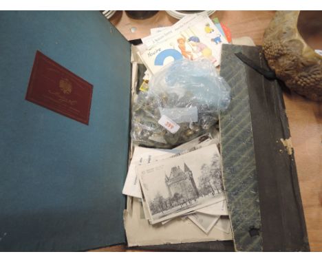 A selection of vintage military and army related ephemera including badges and buttonsAn assortment of mix of regimental bras