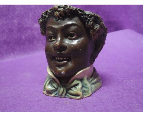 A vintage ceramic figure head in a Black a moor style stamped 338 to base