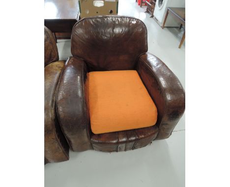 A vintage art deco leather club style armchair 