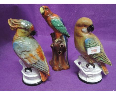 A selection of vintage parrot or similar bird studies and figures