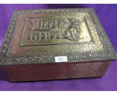 A vintage brass worked slipper box with dog decor