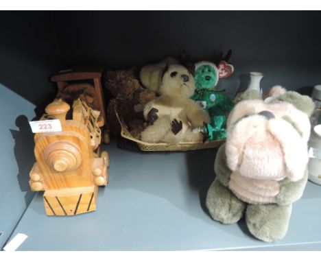 A selection of vintage cuddly and soft toys including wooden train