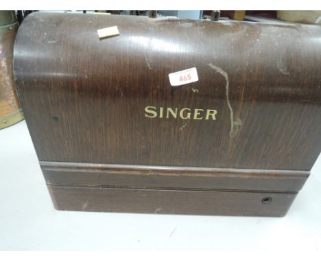 A vintage sewing machine and carry caseCR - boxed is locked, no key.