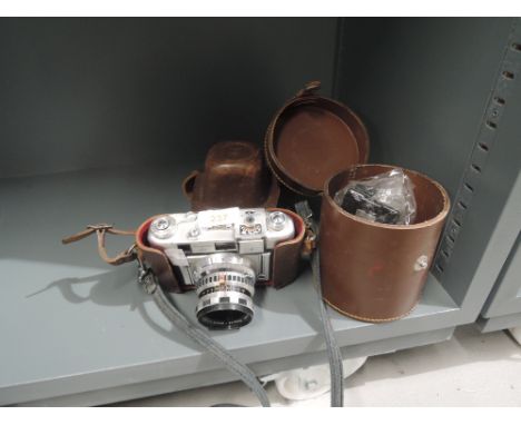 A vintage photography camera the Regula IIID and spares