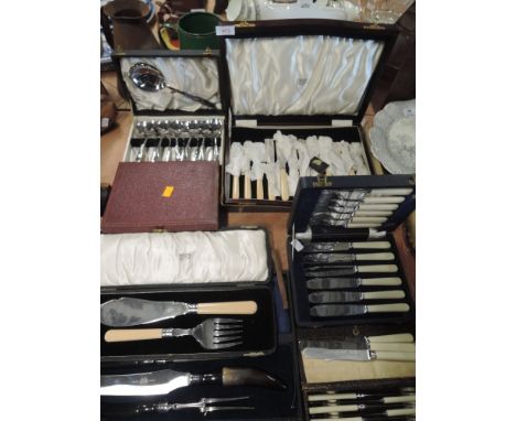 A selection of vintage boxed flatware cutlery and table items 