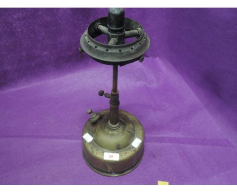 A vintage brass cooking stove or gas burner