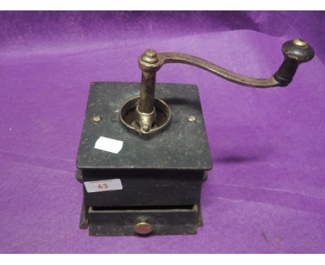 A vintage heavy cast coffee grinder stamped no. 3