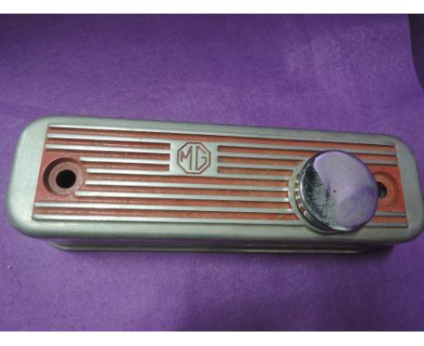 A vintage motor car engine part rocker top for MG 