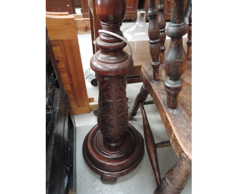 A mahogany effect standard lamp