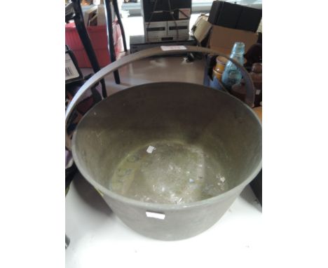 A vintage brass cast jam pan