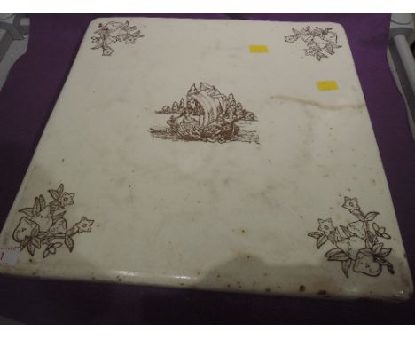 A vintage ceramic chopping board with transfer print an enamel finish