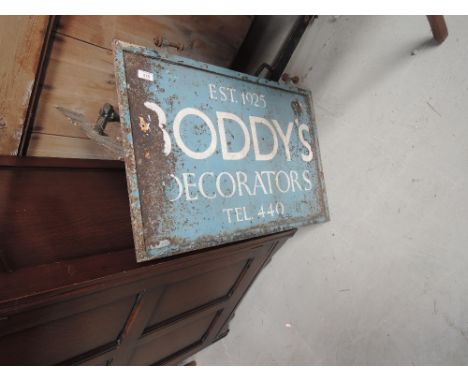 A vintage metal shop/factory sign , having cast bracket