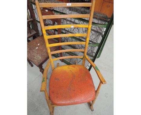 A traditional ladder back rocking chair