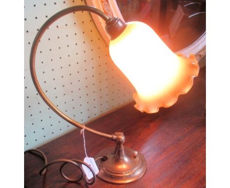 A gilt brass adjustable desk lamp, with opaline frilled glass shade.