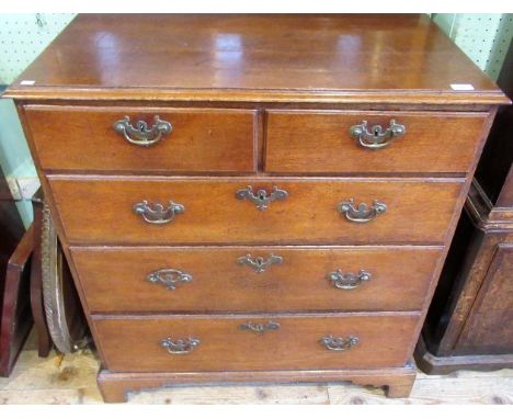 A George III oak chest, the rectangular top with moulded edge over two short and three graduated long drawers, each with bras