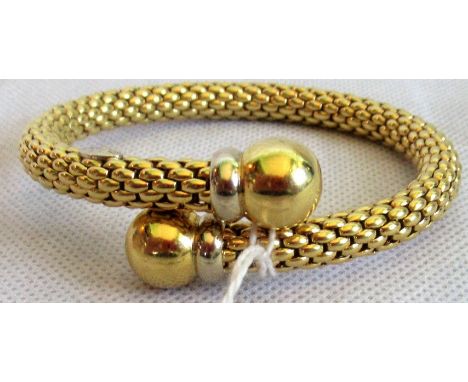 A precious yellow metal flexible fancy link bangle with polished spherical terminals, signed Fope and marked 750. Condition R