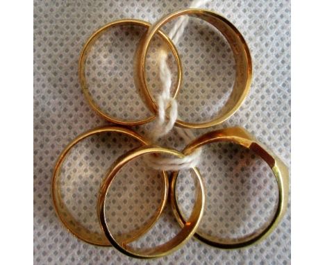 Two 22ct gold wedding bands, together with an 18ct gold wedding band and another, engraved 18ct gold wedding band and an 18ct