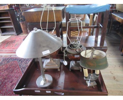 A Tole ware two light table lamp, together with two copper table lamps converted from samovars and a steel table lamp with co