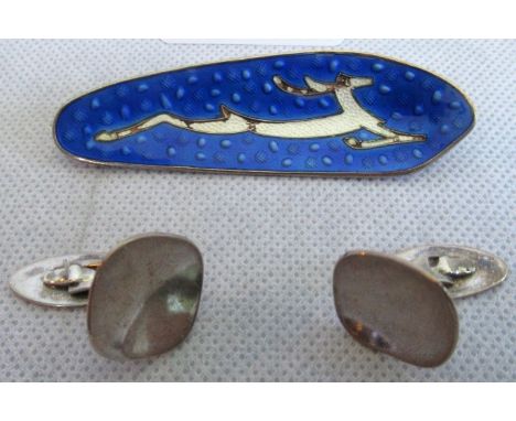 A Scandinavian enamel brooch, decorated with a running deer, together with a pair of Scandinavian cufflinks.