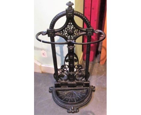 A late Victorian black painted cast iron stick stand in the Coalbrookdale style.