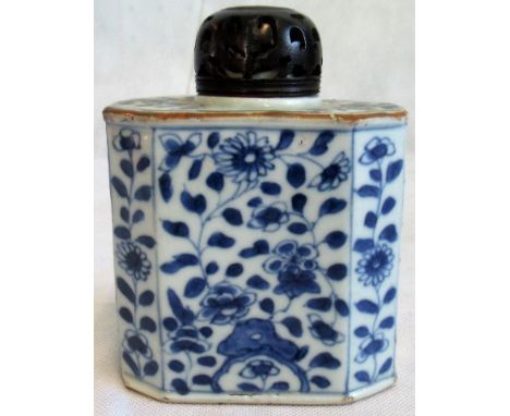 An 18th century Chinese blue and white rectangular canted form tea caddy with later carved and pierced hardwood cover.