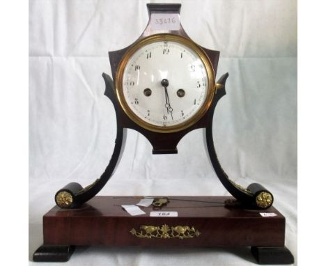 A French 19th century Empire design mantle clock, with scrolling lyre form supports and gilt metal mounts, the convex dial ma