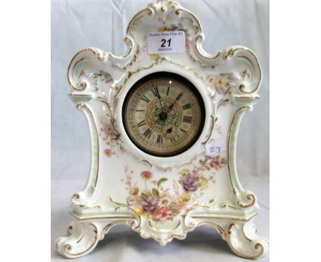 An early 20th century French porcelain bodied mantle clock, decorated with sprays of summer blooms.