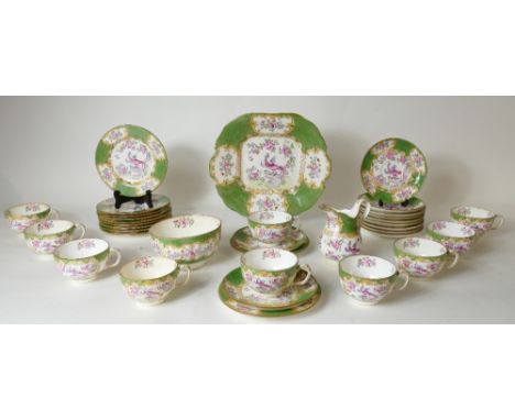 Minton tea set in the Cockatrice design: Set consisting of 11 saucers, 11 side plates, milk jug (crack to spout), 10 cups (1 