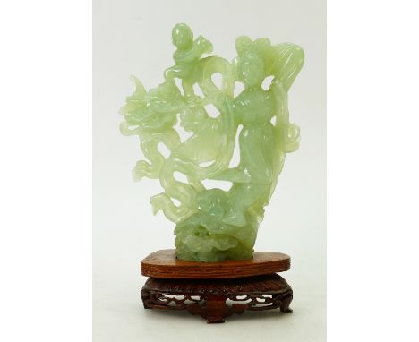 Chinese carved Jade figure: Figure on carved wooden stand. Standing 23.5cm high inc. base.  Some small areas of damage.