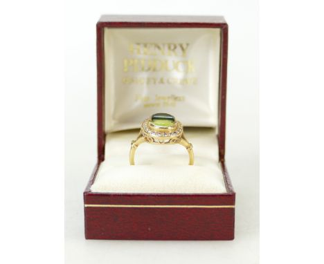 18ct gold Diamond ring: Ring set with centre dark and light precious stones surrounded by diamonds, size N/O, 6.5 grams.