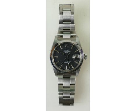 Gentlemans Rolex Oyster wristwatch: Rolex Oyster stainless steel Perpetual Date Superlative Chronometer with black dial and s