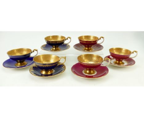 A harlequin collection of Aynsley gilded tea cups and saucers: Aynsley cups and saucers decorated with various fruit by J A B
