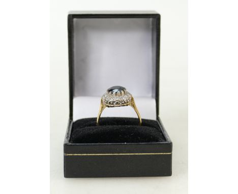 18ct gold Sapphire Diamond ring: Ring set with centre sapphire and 14 diamonds, size P/Q, 5.3 grams, (hallmark worn).