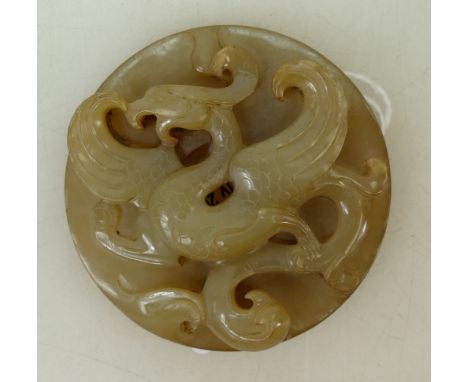 A Chinese Jade Exotic bird pendant: Pendant diameter 6 cm Provenance Collection of Richard Drew (1938-2017).