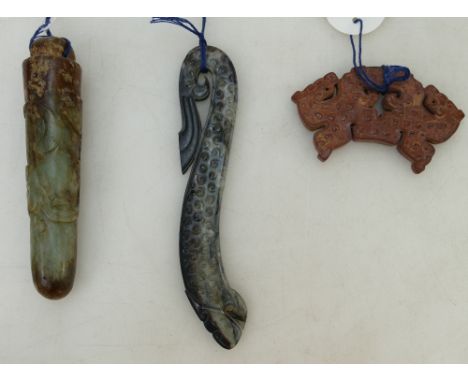 A group of Archaistic Jade carvings: Group comprising a green Jade Chilong plaque, a green and brown Jade pendant and a russe