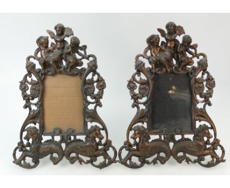 Pair of vintage ornate Cast Iron Photo Frames: Frames decorated with cupids and horses in copper finish, reg marks to reverse