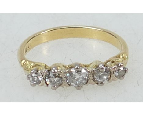 18ct gold ring: Ring set with five diamonds, size N/O, 3.6 grams.